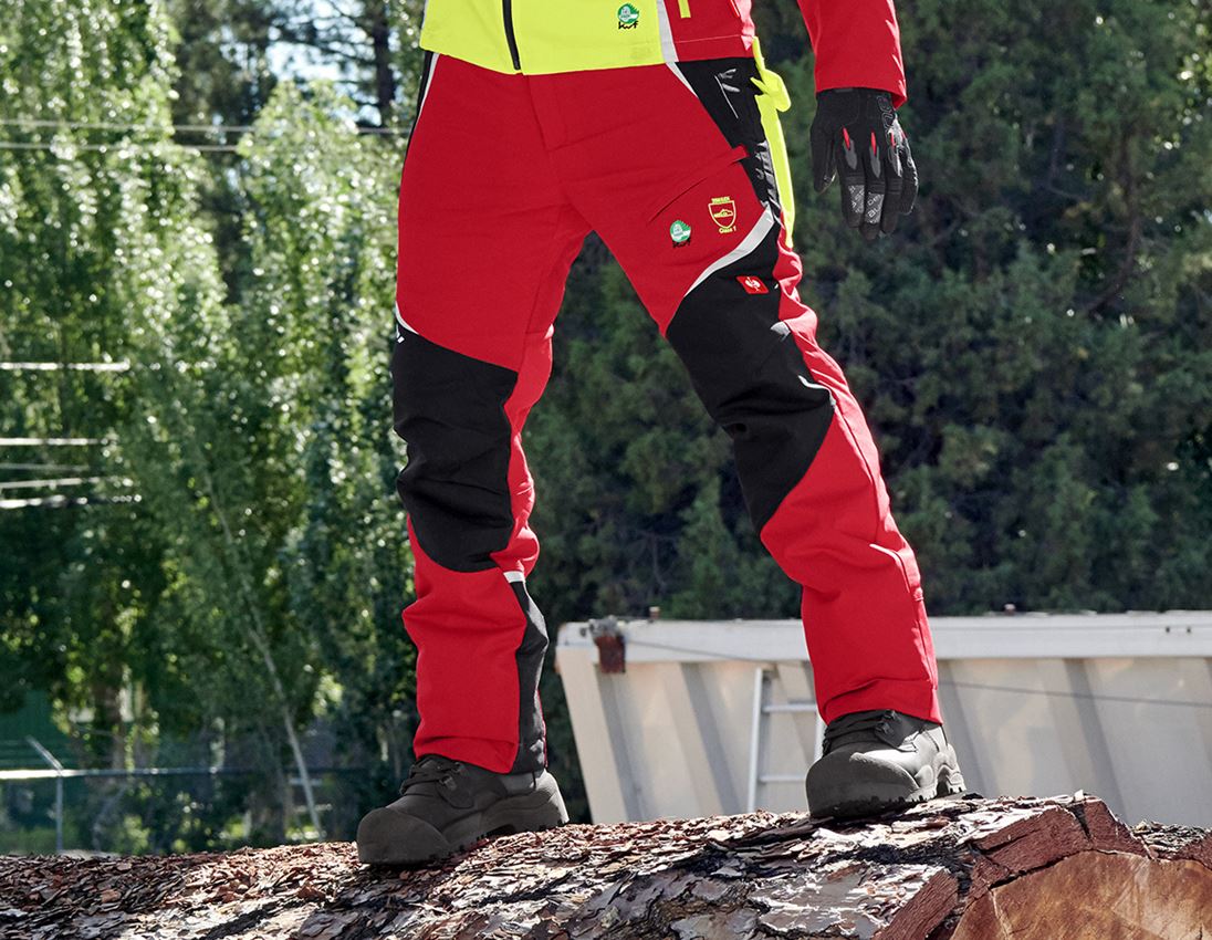 Pracovné nohavice: Lesnícke nohavice, ochr. proti prerezaniu e.s. KWF + červená/výstražná žltá
